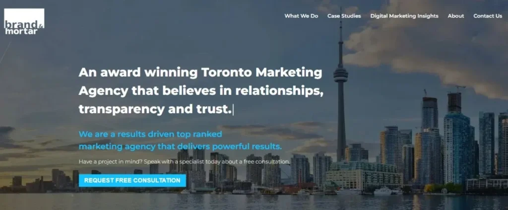 Brand & Mortar Marketing Agency homepage banner. Shows the Toronto skyline with the CN Tower in the background and a large headline: "An award winning Toronto Marketing Agency that believes in relationships, transparency and trust."