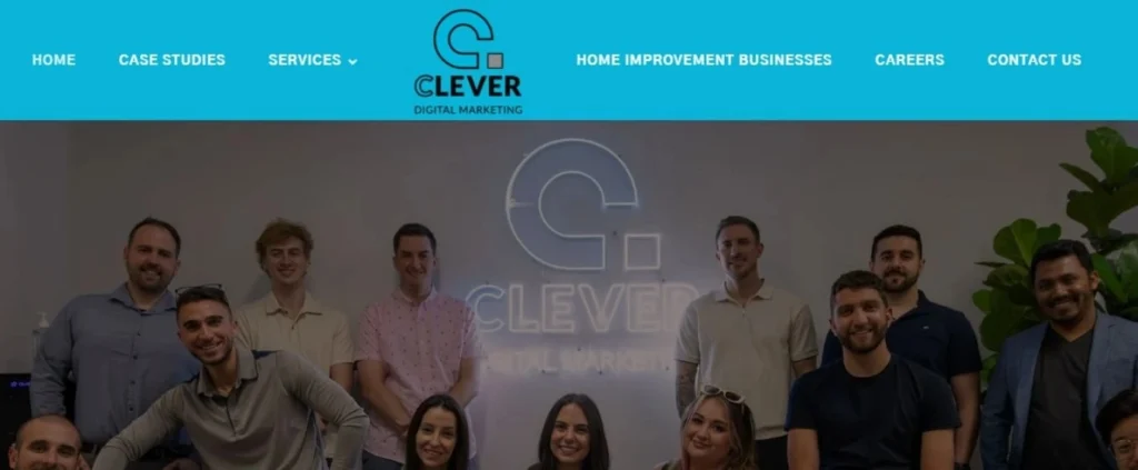 Clever Digital Marketing agency team posing in front of a neon sign with the company name, below the main navigation menu.