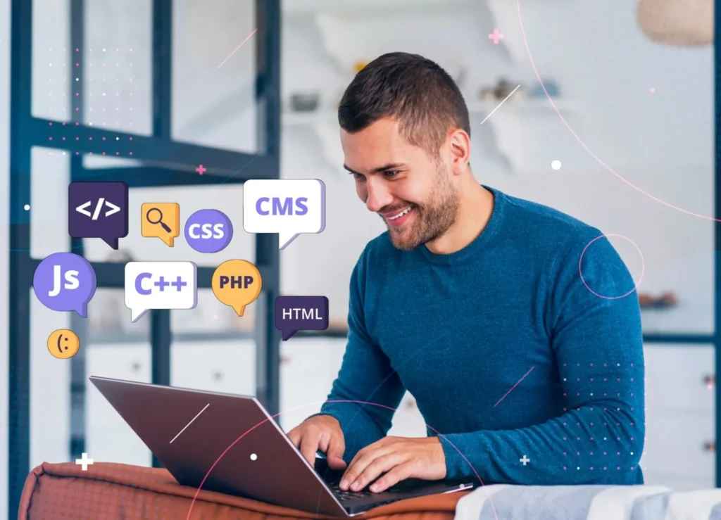 A smiling man working on a laptop surrounded by speech bubbles indicating various web technologies like JS (JavaScript), C++, CSS, PHP, HTML, and CMS, representing modern website development.