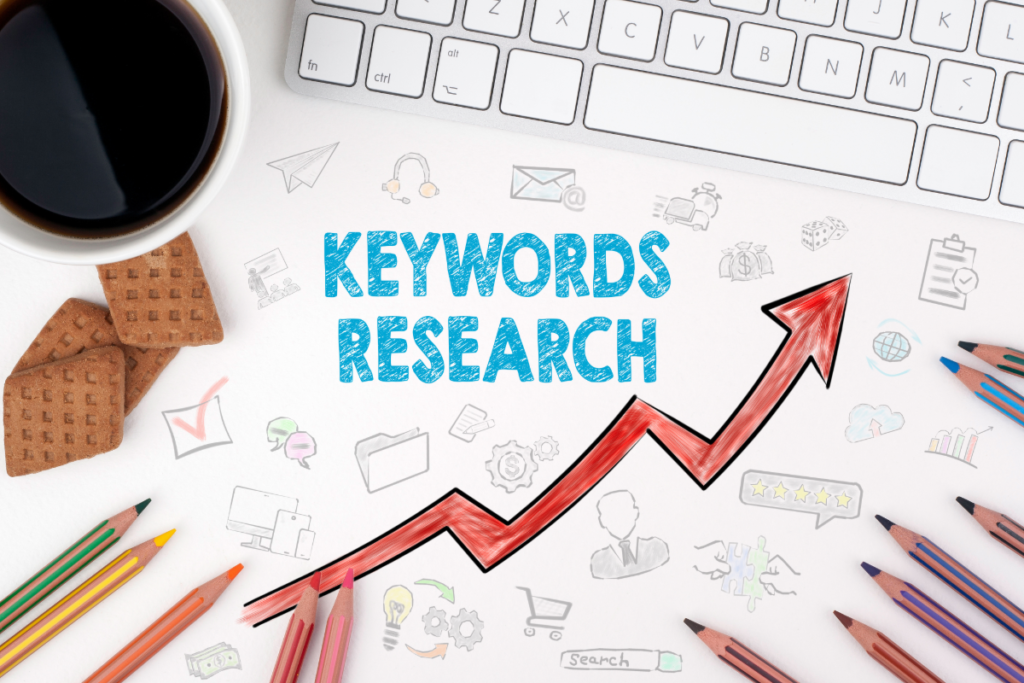 Programmatic SEO keyword research concept showing a growth arrow, colorful pencils, coffee, and SEO icons on a desk.